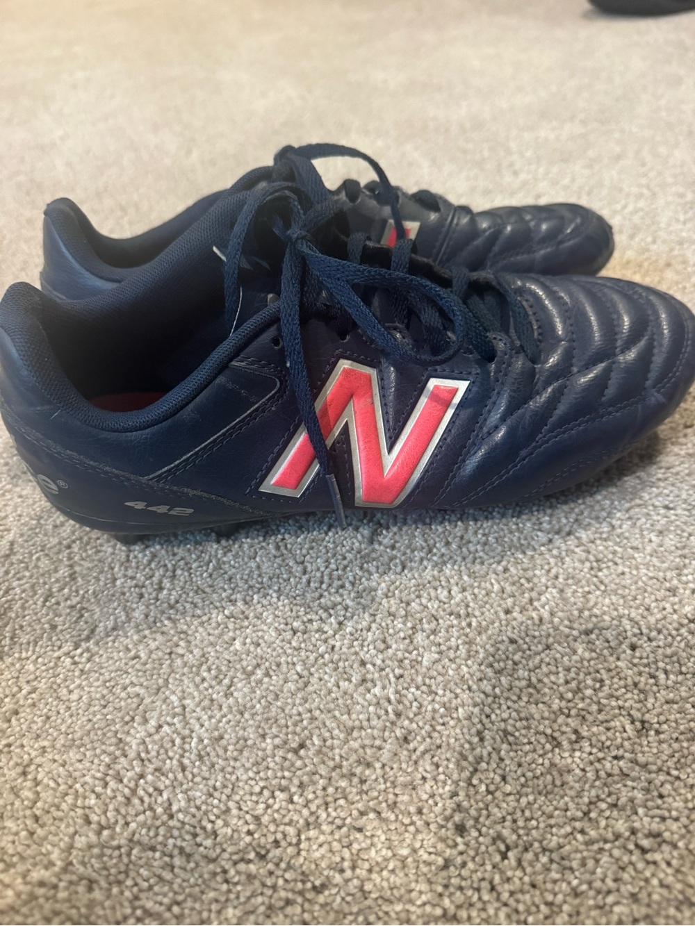 New Balance Men's Navy Athletic Cleats with Red Accent